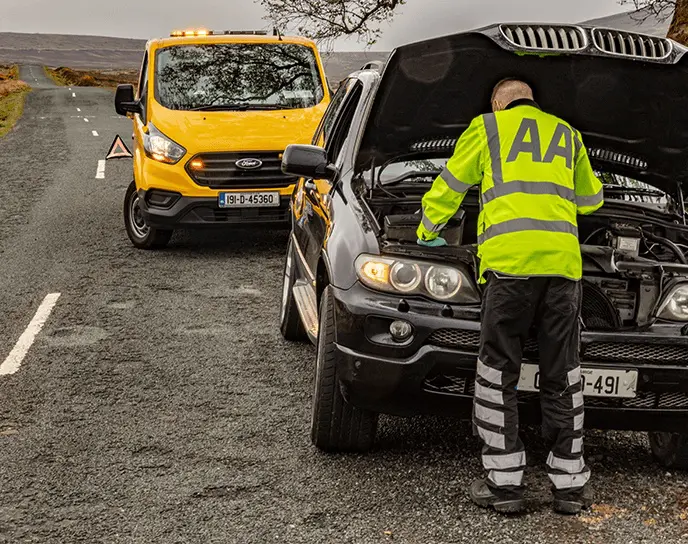 AA Roadside Rescue repairing a car on the roadside, AA Breakdown Assistance, AA Roadside Assistance