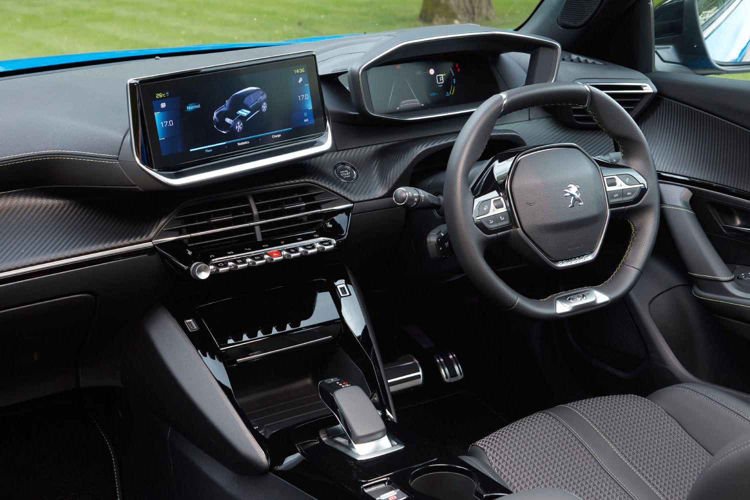 This is a photo of the interior of the Peugeot e2008 with a piano black interior. 