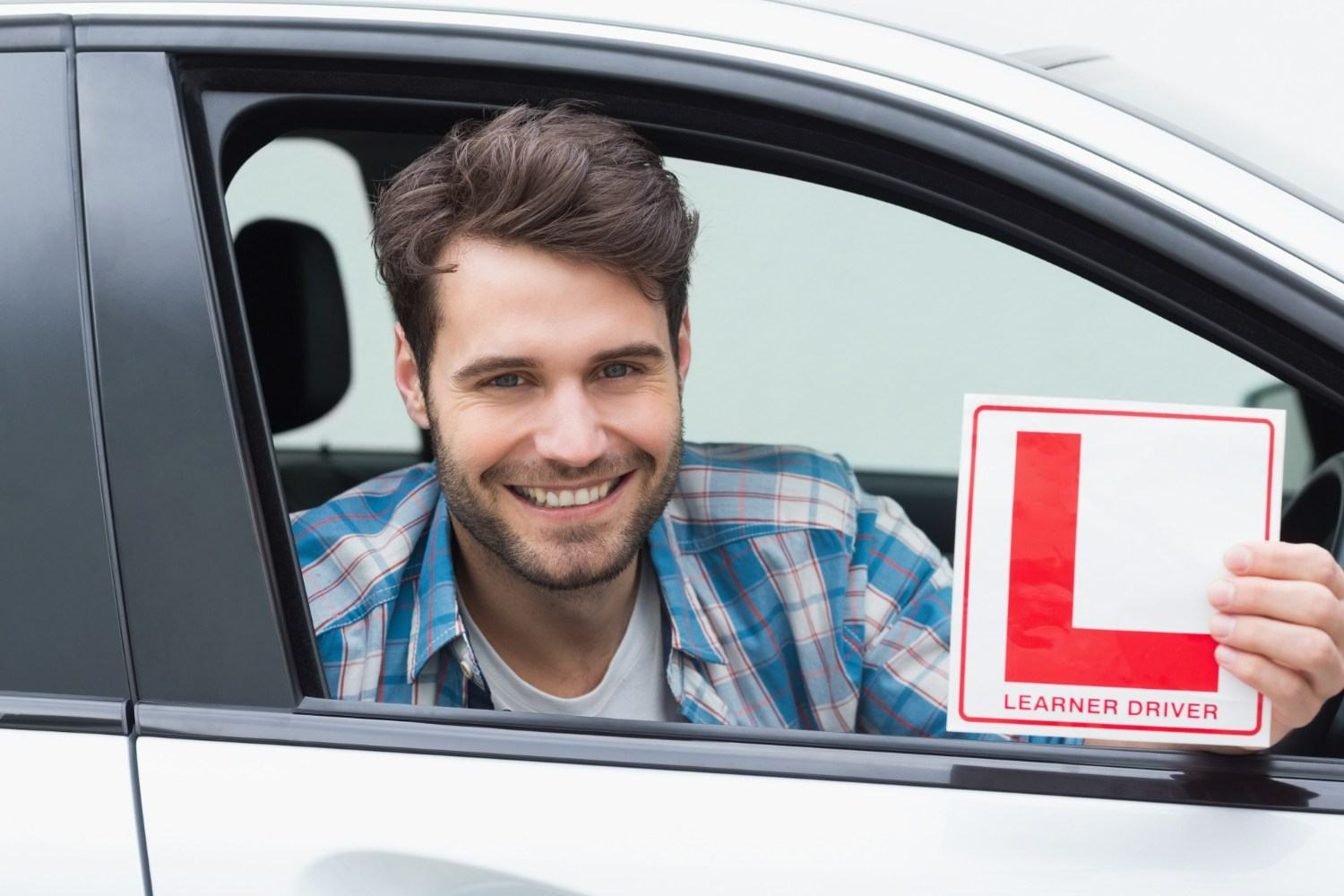 Learner Driver holding learner plate