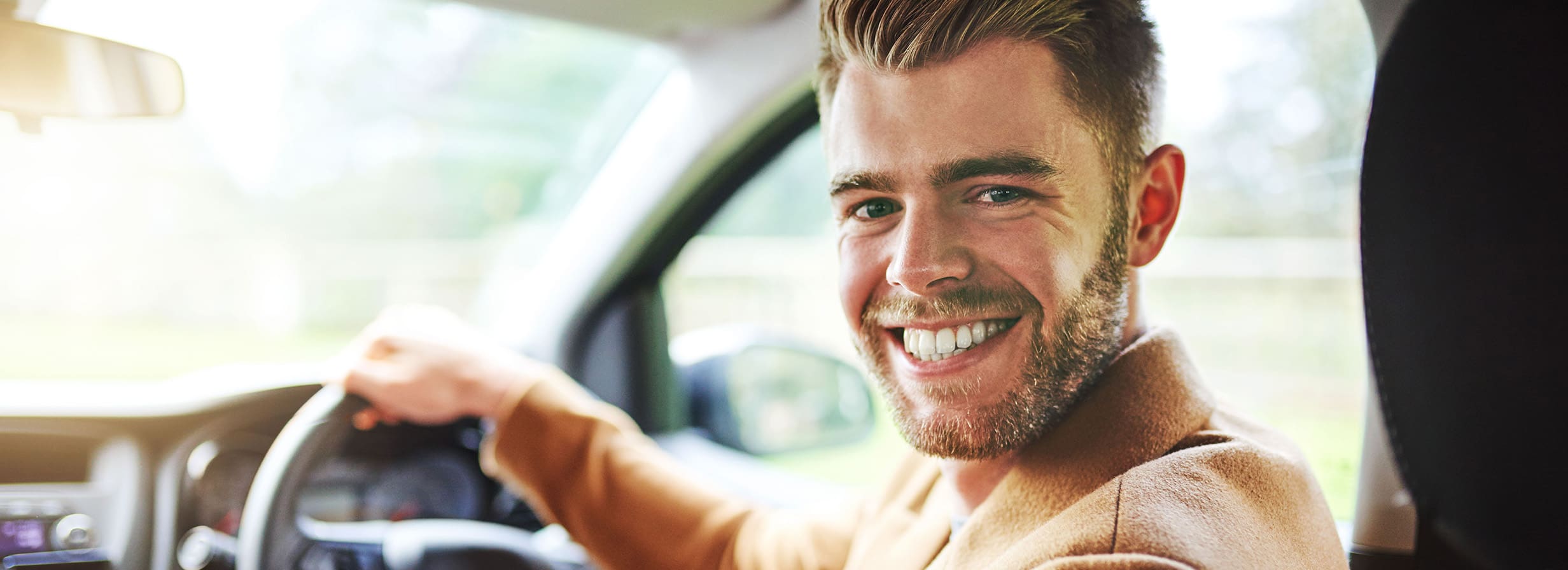 AA Approved Cars - New car owner sitting behind the wheel