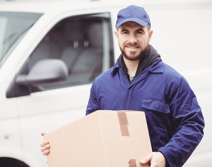 Van driver carrying a parcel