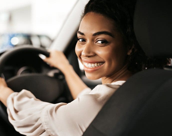 Young driver behind the wheel of a car