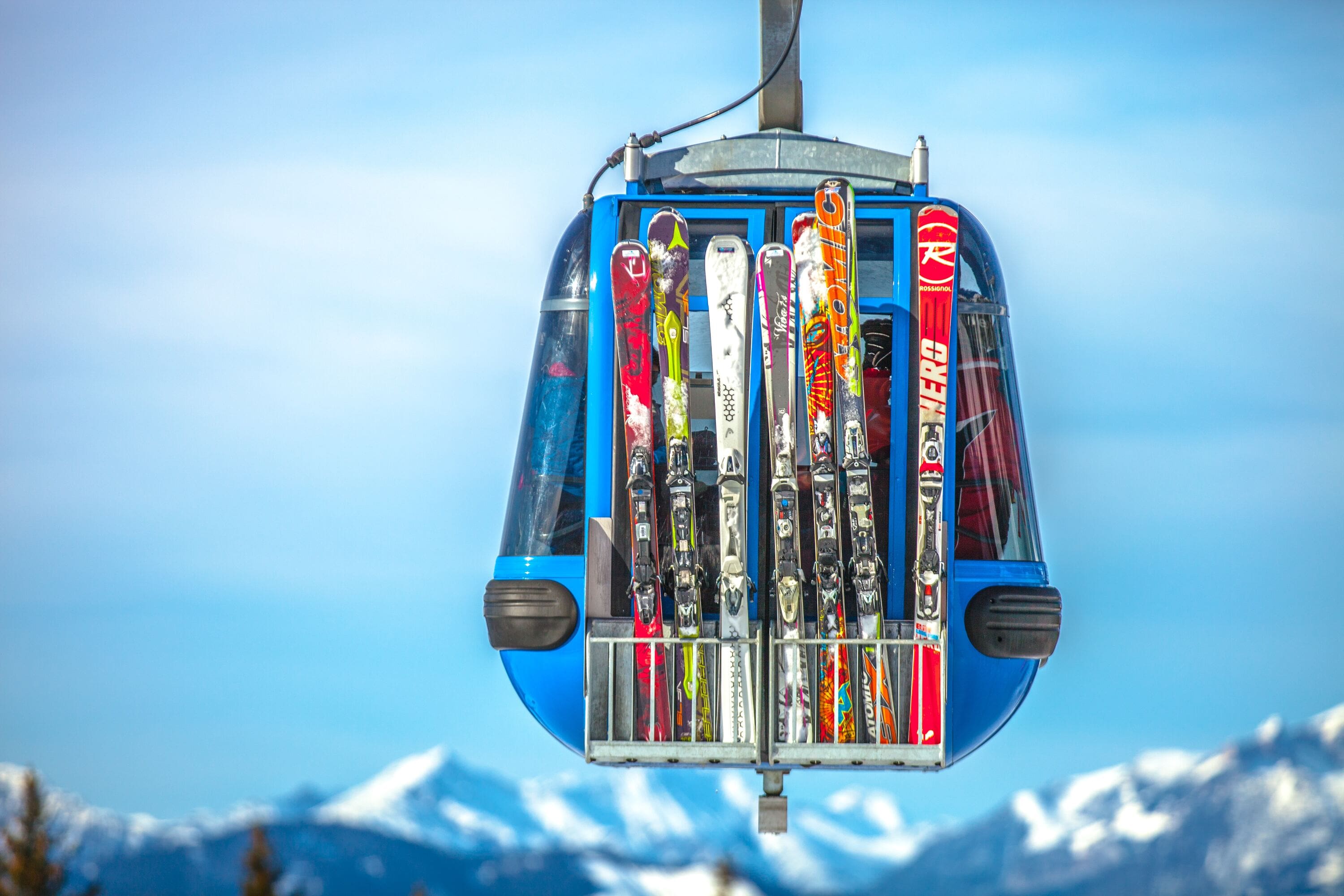 Ski equipment including skis and poles on a snowy slope